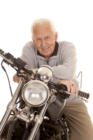 Older man sitting on a motorcycle