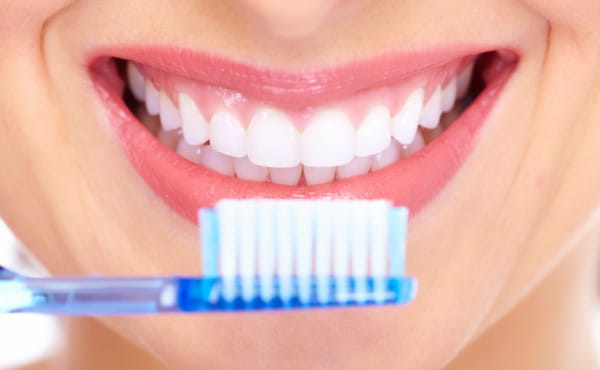 Beautiful woman smile. Beautiful woman smiling after brushing her teeth in the morning