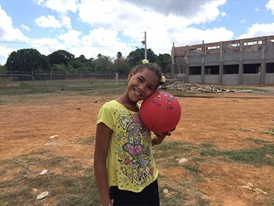 Girl holding Smiles for Life ball