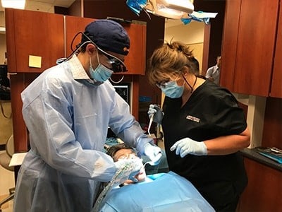 Dr. Taylor Rice working on a patient
