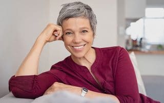 mature woman resting on her couch at home
