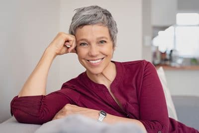 mature woman relaxing on the couch at home
