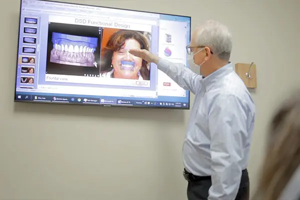 Dr Scott Rice discussing All-on-X dental implants with an xray