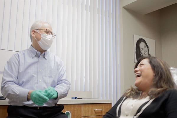 Dr. Rice laughing with a patient
