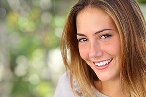 Beautiful young woman with a perfectly, whitened smile.